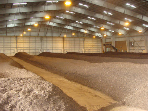 Photo of compost stored in large shed